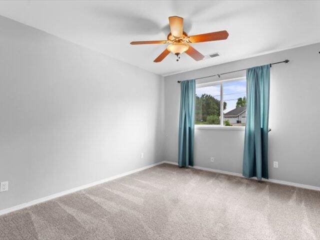 15540 China Rapids Dr, Red Bluff, CA 96080 - spare room featuring a ceiling fan and carpet