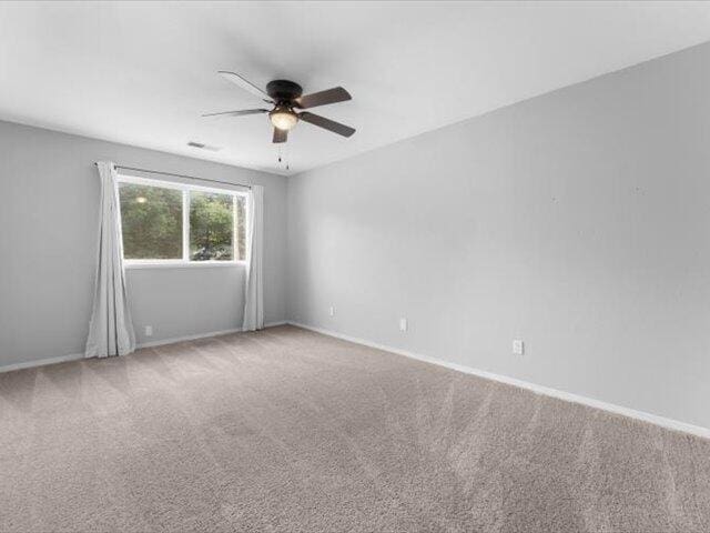 15540 China Rapids Dr, Red Bluff, CA 96080 - carpeted empty room with a ceiling fan and baseboards