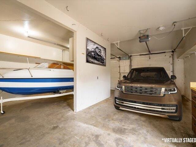 15540 China Rapids Dr, Red Bluff, CA 96080 - garage featuring a garage door opener
