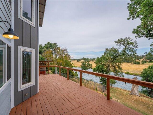 15540 China Rapids Dr, Red Bluff, CA 96080 - wooden terrace with a water view