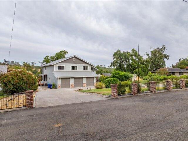 15540 China Rapids Dr, Red Bluff, CA 96080 - view of front of home with a garage and concrete driveway