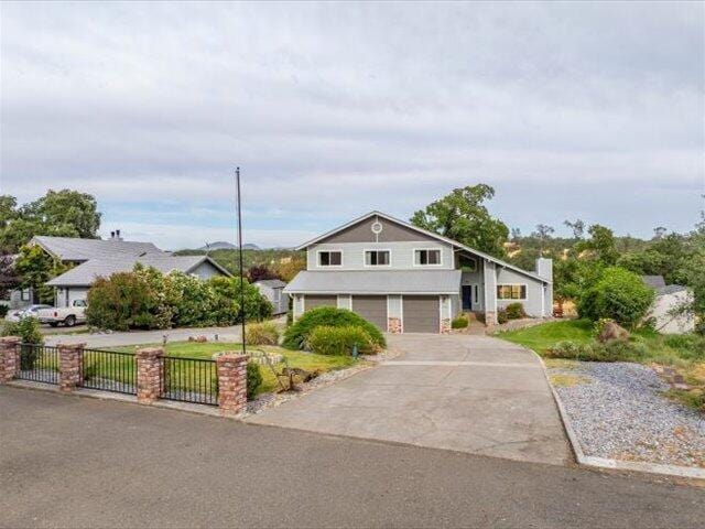15540 China Rapids Dr, Red Bluff, CA 96080 - view of front facade with an attached garage and driveway