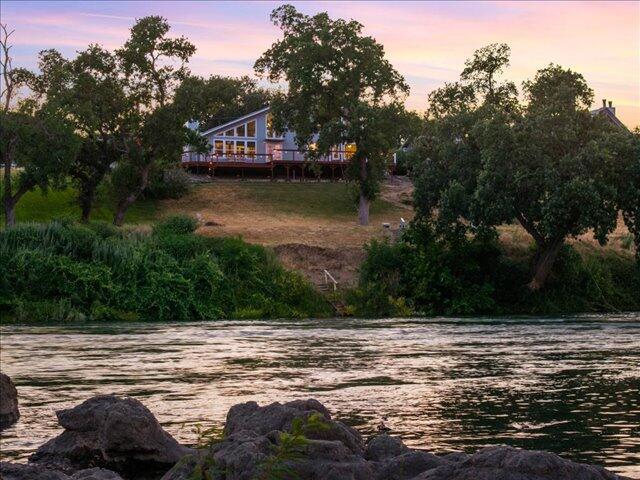 15540 China Rapids Dr, Red Bluff, CA 96080 - view of yard with a deck with water view