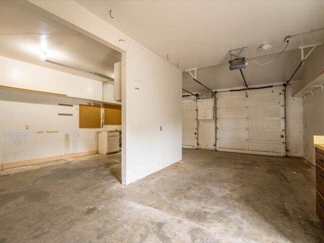 15540 China Rapids Dr, Red Bluff, CA 96080 - garage featuring a garage door opener
