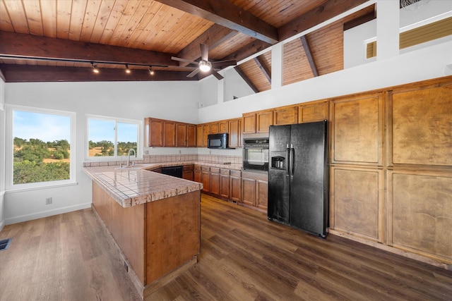 3400 Hillcrest St, Redding, CA 96001 - kitchen with black appliances, a wood ceiling with exposed beams, rail lighting, a peninsula, and high vaulted ceiling
