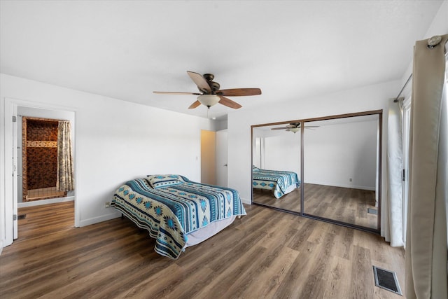 3400 Hillcrest St, Redding, CA 96001 - bedroom with wood finished floors, a closet, and a ceiling fan