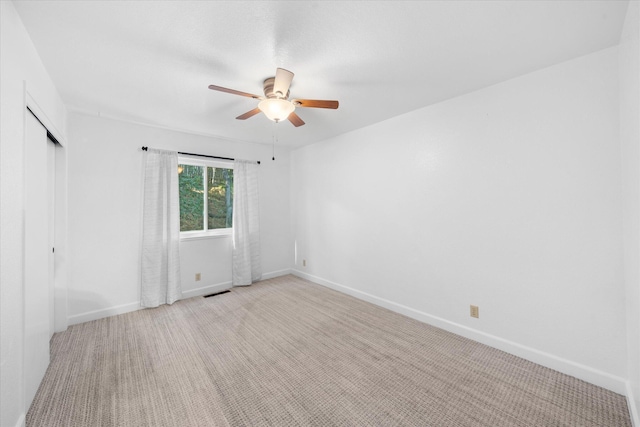 3400 Hillcrest St, Redding, CA 96001 - unfurnished bedroom with a closet, light colored carpet, and a ceiling fan