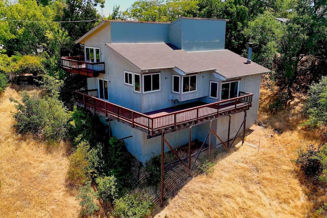 3400 Hillcrest St, Redding, CA 96001 - back of property featuring a balcony, a shingled roof, and a wooden deck