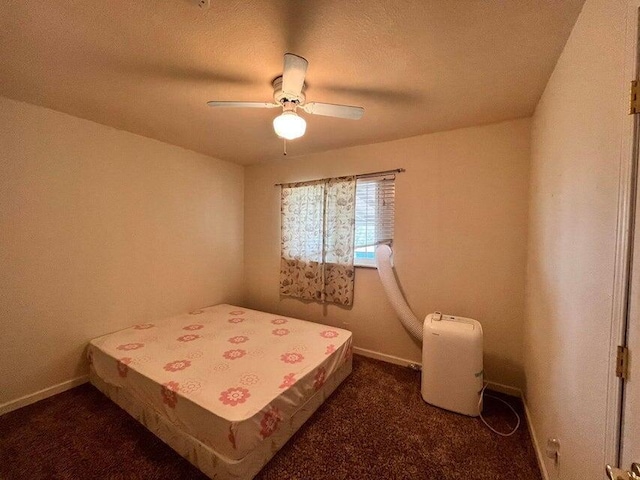21657 W Elk Trl, Redding, CA 96003 - bedroom featuring a ceiling fan, a textured ceiling, and dark carpet