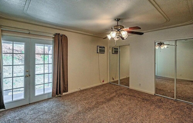 21657 W Elk Trl, Redding, CA 96003 - unfurnished bedroom with carpet flooring, french doors, multiple closets, a textured ceiling, and a ceiling fan