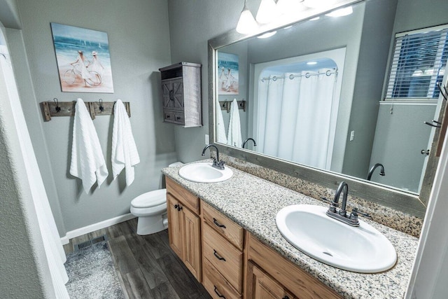 35363 Nehemiah Dr, Shingletown, CA 96088 - bathroom with wood finished floors and double vanity