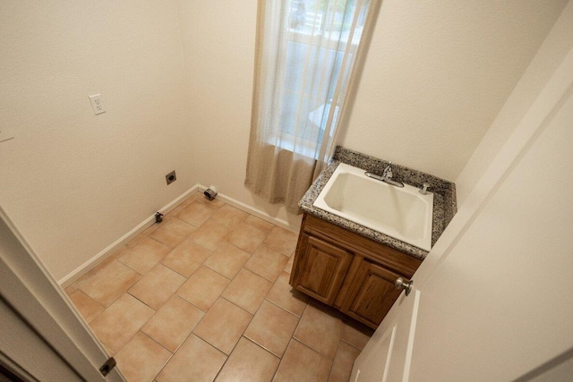 35363 Nehemiah Dr, Shingletown, CA 96088 - laundry room with hookup for an electric dryer, light tile patterned floors, and cabinet space