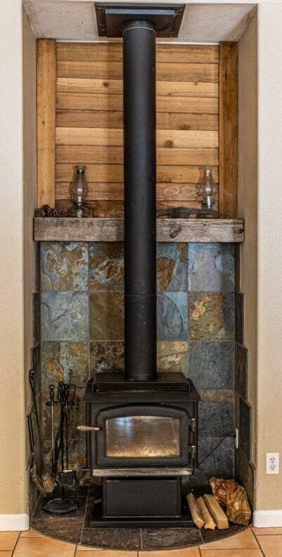 35363 Nehemiah Dr, Shingletown, CA 96088 - detailed view of a wood stove and baseboards
