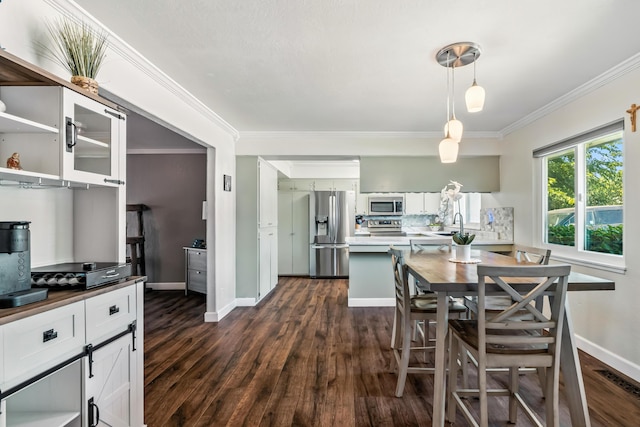 3442 Thomas Ave, Anderson, CA 96007 - dining room featuring dark wood finished floors and crown molding