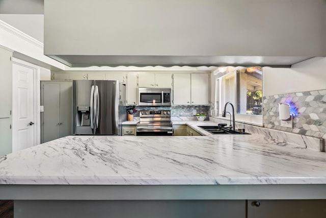 3442 Thomas Ave, Anderson, CA 96007 - kitchen featuring stainless steel appliances, decorative backsplash, and light stone countertops