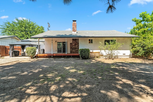 3442 Thomas Ave, Anderson, CA 96007 - rear view of house with a gazebo, a chimney, stucco siding, a wooden deck, and crawl space