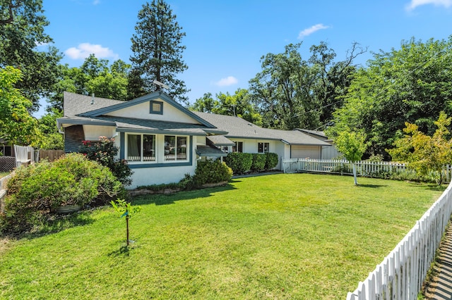 3442 Thomas Ave, Anderson, CA 96007 - view of front of property with a fenced backyard, an attached garage, and stucco siding