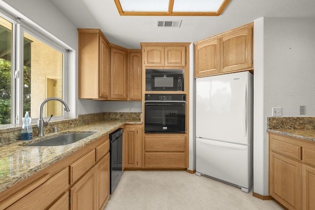 19258 Granola Way, Cottonwood, CA 96022 - kitchen with black appliances, light stone counters, and light carpet