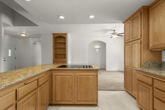 19258 Granola Way, Cottonwood, CA 96022 - kitchen featuring black electric cooktop, arched walkways, light colored carpet, ceiling fan, and recessed lighting