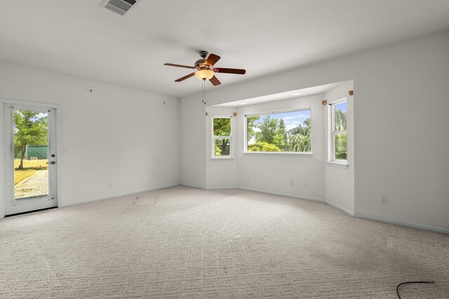 19258 Granola Way, Cottonwood, CA 96022 - unfurnished room with a ceiling fan, plenty of natural light, and light colored carpet