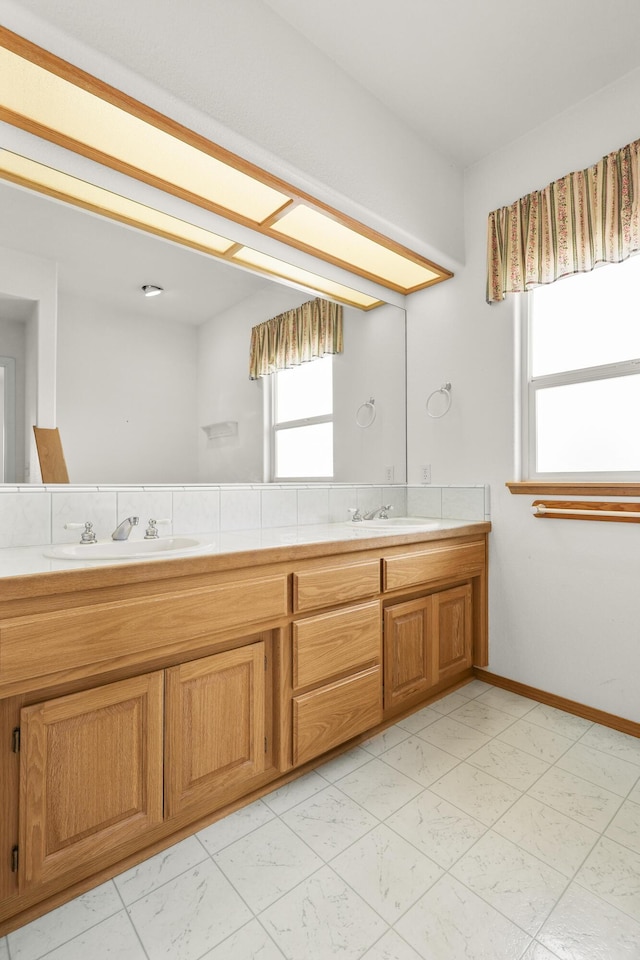 19258 Granola Way, Cottonwood, CA 96022 - bathroom with double vanity, healthy amount of natural light, and marble finish flooring