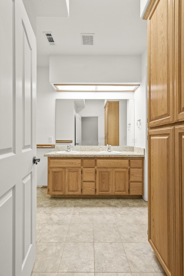 19258 Granola Way, Cottonwood, CA 96022 - bathroom featuring double vanity and tile patterned flooring