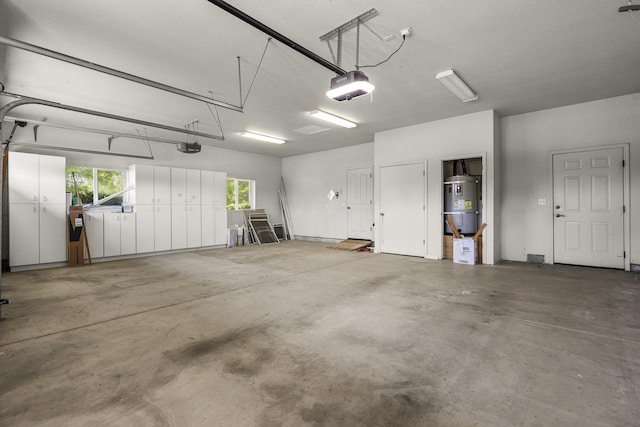 19258 Granola Way, Cottonwood, CA 96022 - garage featuring water heater and a garage door opener