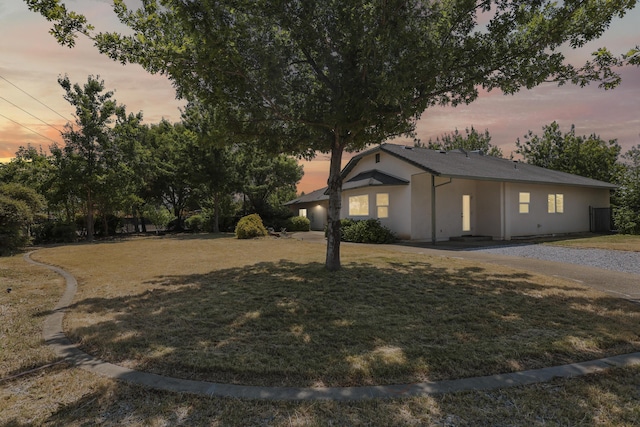 19258 Granola Way, Cottonwood, CA 96022 - view of side of home with a yard and stucco siding