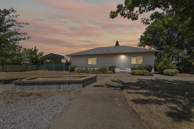 19258 Granola Way, Cottonwood, CA 96022 - view of front of house with stucco siding and a detached carport
