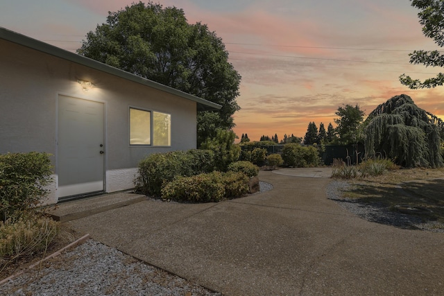 19258 Granola Way, Cottonwood, CA 96022 - property exterior at dusk with stucco siding