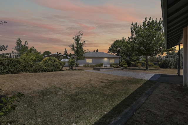 19258 Granola Way, Cottonwood, CA 96022 - yard at dusk featuring a lawn