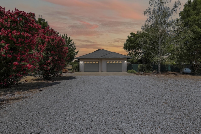 19258 Granola Way, Cottonwood, CA 96022 - view of front of home featuring a garage, driveway, and stucco siding