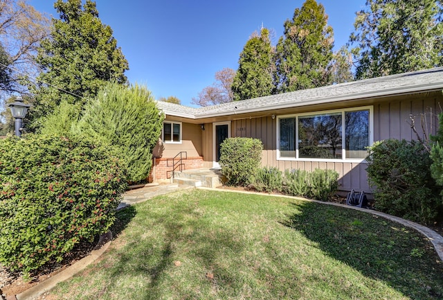 3283 Middleton Ln, Redding, CA 96002 - ranch-style house with a front yard, board and batten siding, brick siding, and a shingled roof