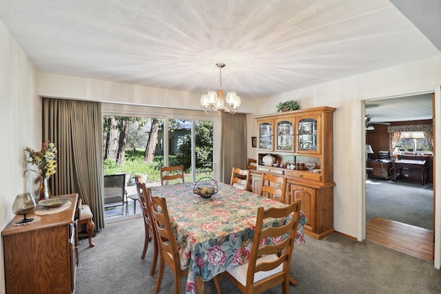 3283 Middleton Ln, Redding, CA 96002 - carpeted dining room with healthy amount of natural light and a chandelier