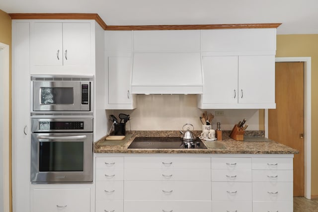3283 Middleton Ln, Redding, CA 96002 - kitchen with stainless steel appliances, white cabinetry, premium range hood, and stone countertops