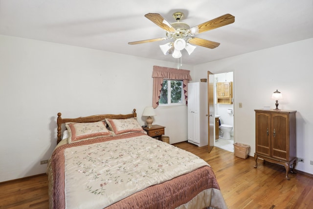 3283 Middleton Ln, Redding, CA 96002 - bedroom featuring light wood-style flooring, connected bathroom, and ceiling fan