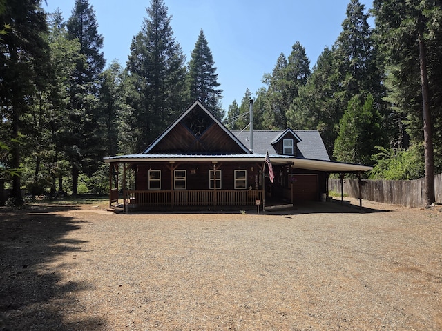 8421 Starlite Pines Rd, Shingletown, CA 96088 - view of front of property with covered porch, driveway, an attached carport, and an attached garage