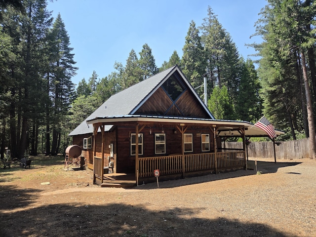 8421 Starlite Pines Rd, Shingletown, CA 96088 - view of front of house with a porch and a metal roof
