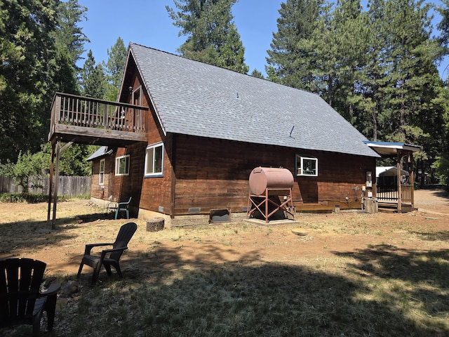 8421 Starlite Pines Rd, Shingletown, CA 96088 - rear view of property with roof with shingles, a wooden deck, and crawl space