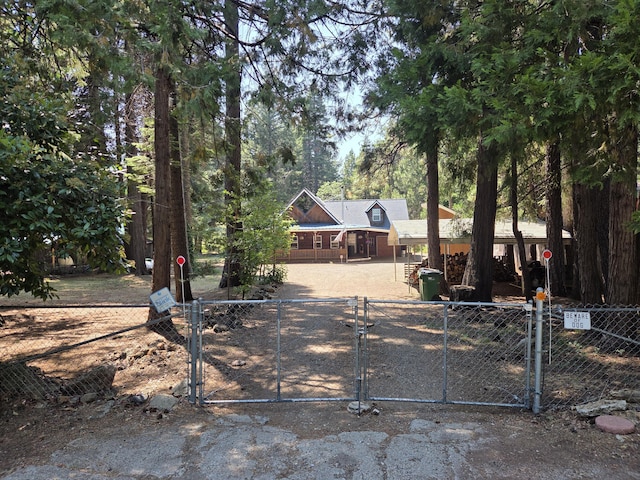 8421 Starlite Pines Rd, Shingletown, CA 96088 - chalet / cabin featuring a gate