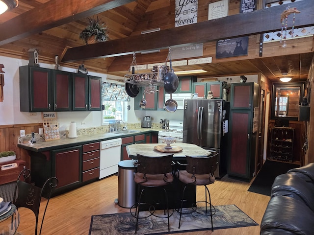 8421 Starlite Pines Rd, Shingletown, CA 96088 - kitchen with white appliances, light wood-style floors, wood ceiling, wooden walls, and a wainscoted wall