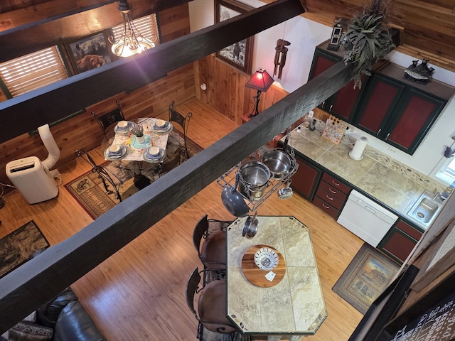 8421 Starlite Pines Rd, Shingletown, CA 96088 - living area featuring a chandelier, wood finished floors, and wooden walls
