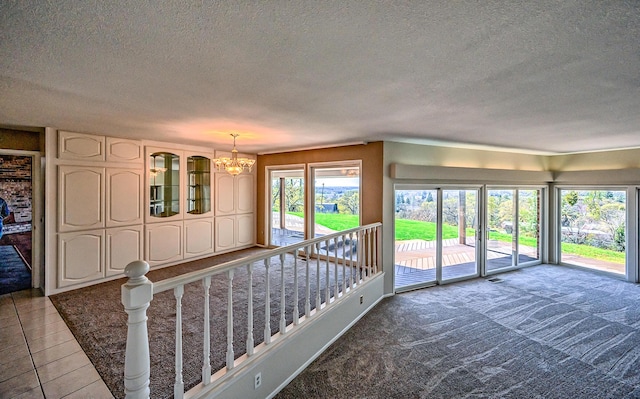 21790 Adobe Rd, Red Bluff, CA 96080 - unfurnished living room with a chandelier and a textured ceiling