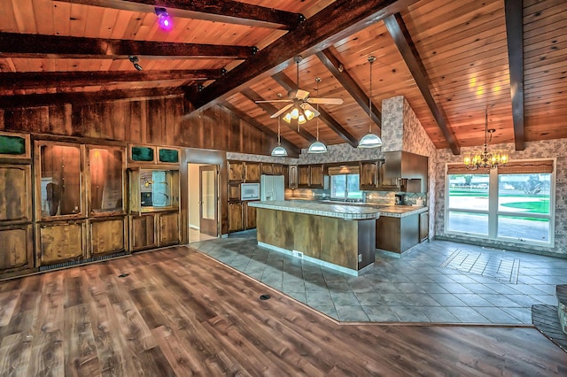 21790 Adobe Rd, Red Bluff, CA 96080 - kitchen featuring a chandelier, a kitchen island, white appliances, dark wood-type flooring, and a wooden ceiling with exposed beams