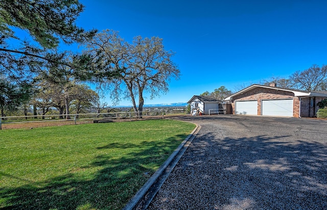 21790 Adobe Rd, Red Bluff, CA 96080 - view of yard featuring asphalt driveway, a garage, and an outdoor structure