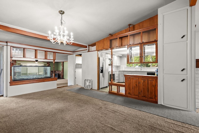 4100 Fort Peck St, Shasta Lake, CA 96019 - kitchen with stainless steel fridge with ice dispenser, light carpet, open floor plan, a chandelier, and light countertops