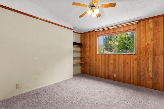 4100 Fort Peck St, Shasta Lake, CA 96019 - empty room with carpet flooring, ceiling fan, wood walls, and lofted ceiling
