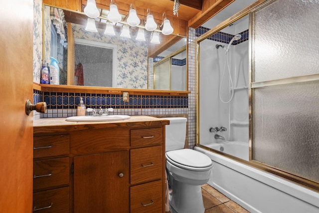 4100 Fort Peck St, Shasta Lake, CA 96019 - bathroom with vanity, tile patterned flooring, enclosed tub / shower combo, wallpapered walls, and tile walls