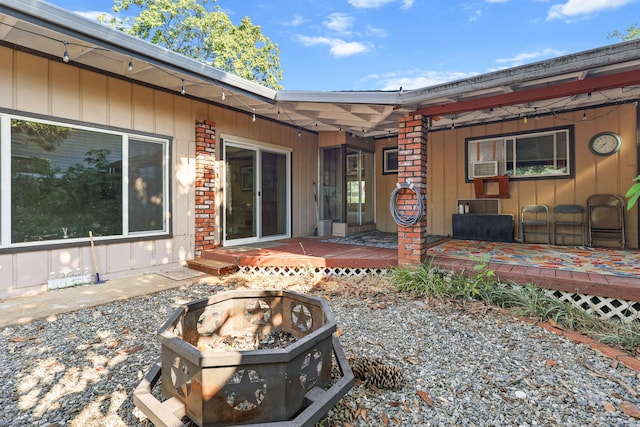 4100 Fort Peck St, Shasta Lake, CA 96019 - back of house with an outdoor fire pit and a wooden deck
