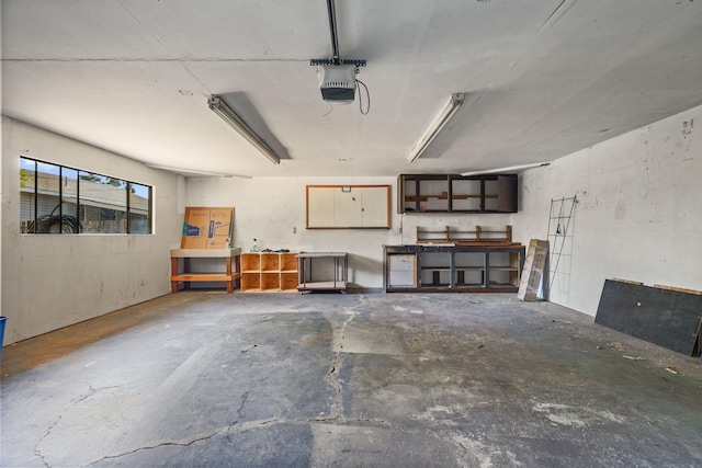 4100 Fort Peck St, Shasta Lake, CA 96019 - garage featuring a garage door opener and a workshop area